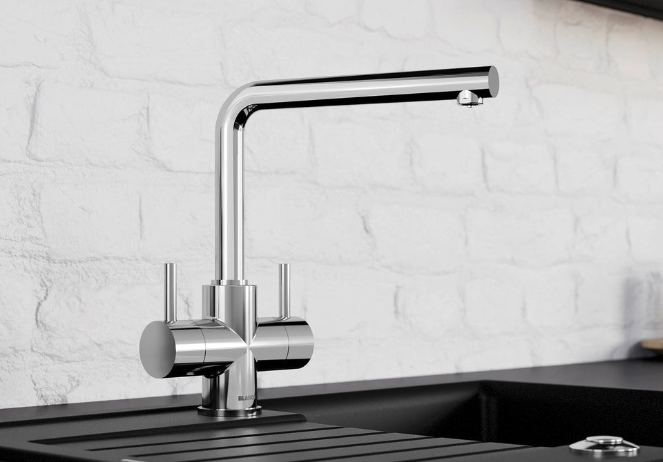 BLANCO Lamia Dual Lever Kitchen Mixer Tap in Chrome against a White Brick Wall