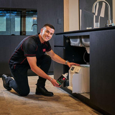 ZIP Water HydroTap 0.2 Micron Filter being fitted in a contemporary kitchen setting