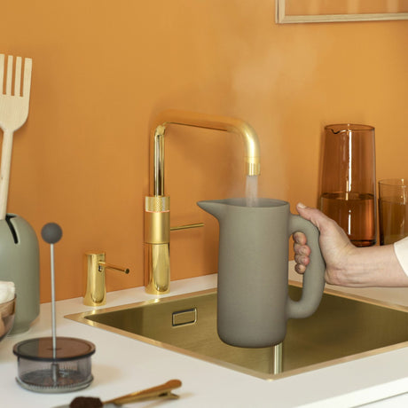 Quooker Fusion Square All-in-One Boiling Hot Cold Kitchen Tap Lifestyle  setting filling jug with boiling water