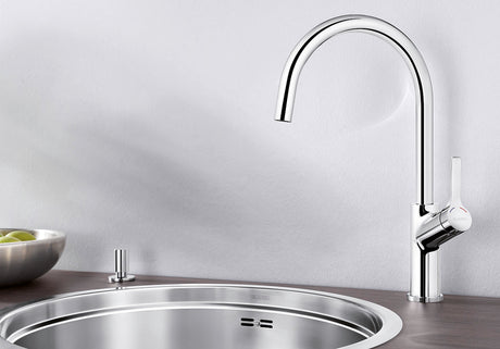 BLANCO Carena Single Lever Kitchen Mixer Tap over a Round Stainless Steel Sink