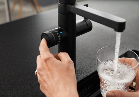 BLANCO Evol-S Pro 4-in-1 Boiling Water Kitchen Tap Filling a Glass with Filtered Water