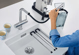 BLANCO Fontas-S II Single Lever Filter Kitchen Mixer Tap with Pull-Out Spray Filling a Coffee Machine Tank with Filtered Water