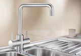 BLANCO Jamia Dual Lever Kitchen Mixer Tap on a Stainless Steel Sink Drainer