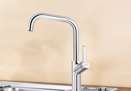 BLANCO Jurena Single Lever Kitchen Mixer Tap in Chrome over a Stainless Steel Sink