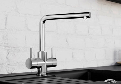BLANCO Lamia Dual Lever Kitchen Mixer Tap in Chrome against a White Brick Wall