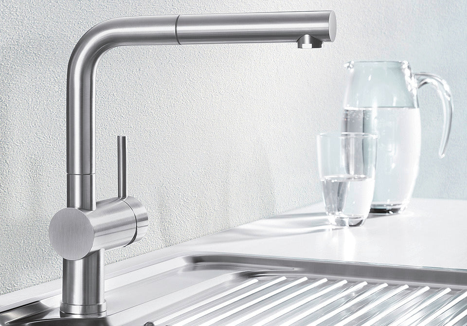 BLANCO Linus-S Single Lever Kitchen Mixer Tap with Pull-Out Spray in Chrome with a Jug of Water