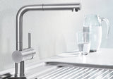 BLANCO Linus-S Single Lever Kitchen Mixer Tap with Pull-Out Spray in Chrome with a Jug of Water