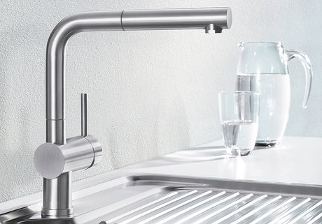 BLANCO Linus-S Single Lever Kitchen Mixer Tap with Pull-Out Spray in Chrome with a Jug of Water