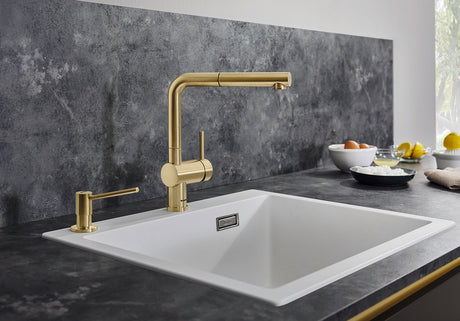 BLANCO Linus-S Single Lever Kitchen Mixer Tap with Pull-Out Spray in Satin Gold over a White Sink